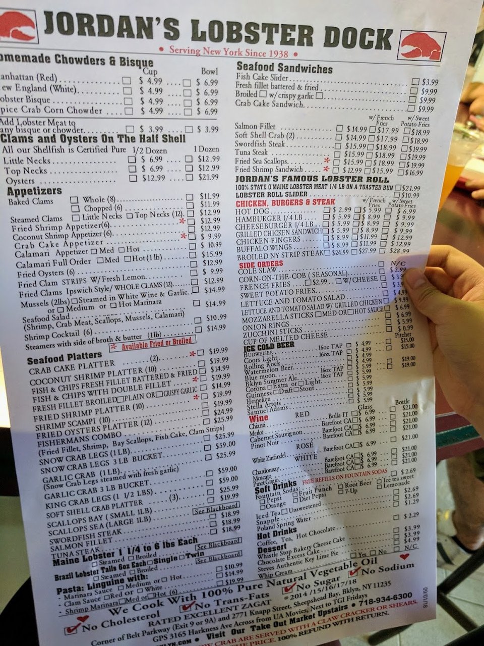 Seafood menu with shellfish and lobster dishes.